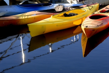 Canoes at Sunriver, Oregon by Michael Axel