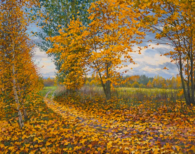 trees with orange leaves and autumn leaves on the ground